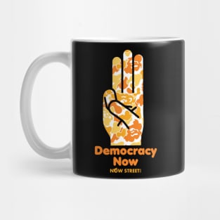 Democracy Now Aimon orange Camo Mug